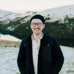 Man smiling in the snowy outdoors